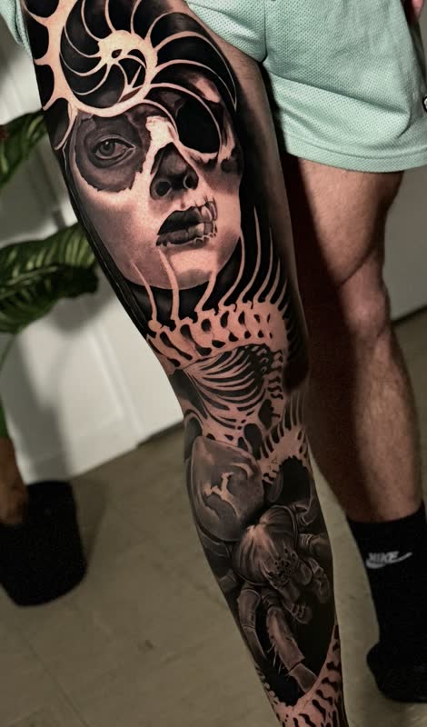 Day of the Dead leg sleeve with painted woman and nautilus shell