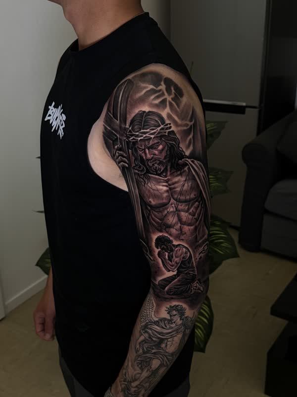 Crucifixion scene upper-arm sleeve in black and grey